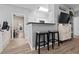 Stylish view of kitchen and bar with views of the Primary bedroom featuring modern appliances and a seamless layout at 1810 E Palm Ave # 5114, Tampa, FL 33605