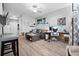 Inviting living room featuring a sectional sofa, stylish decor, and a comfortable workspace area at 1810 E Palm Ave # 5114, Tampa, FL 33605