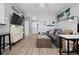 Open concept living space with modern furniture and decor, adjacent to a well-equipped kitchen area at 1810 E Palm Ave # 5114, Tampa, FL 33605