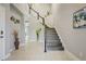 Spacious foyer featuring tile flooring, a staircase, and neutral wall colors at 1949 Parterre Ave, Lutz, FL 33558