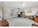 Spacious garage with overhead door, shelving, and ample storage space at 1949 Parterre Ave, Lutz, FL 33558