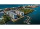 Beautiful condo buildings with private boat docks on a tranquil waterfront at 19531 Gulf Blvd # 604, Indian Shores, FL 33785