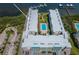 A captivating aerial view showcasing the condo complex and its inviting swimming pool at 19531 Gulf Blvd # 604, Indian Shores, FL 33785