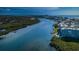 Panoramic aerial view of waterfront condos, docks, and beautiful waterways at 19531 Gulf Blvd # 604, Indian Shores, FL 33785