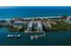 Stunning aerial view of beachfront condos with boat docks and ocean views at 19531 Gulf Blvd # 604, Indian Shores, FL 33785