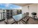 Outdoor balcony with seating and a grill, ideal for al fresco dining at 19531 Gulf Blvd # 604, Indian Shores, FL 33785