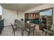 Relaxing balcony seating, a grill, and sliding glass doors into the condo at 19531 Gulf Blvd # 604, Indian Shores, FL 33785