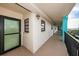 Hallway and unit entrance featuring the unit number and a water view at 19531 Gulf Blvd # 604, Indian Shores, FL 33785