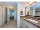 Bathroom featuring a vanity and combination bathtub shower, with a bedroom entrance visible at 19531 Gulf Blvd # 604, Indian Shores, FL 33785
