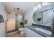 Updated bathroom features a glass shower, granite counter top and modern fixtures at 19531 Gulf Blvd # 604, Indian Shores, FL 33785