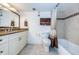 Traditional bathroom with vanity and combination bathtub shower with tile surround at 19531 Gulf Blvd # 604, Indian Shores, FL 33785