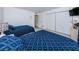 This bedroom features two beds, tiled floors, and access to hall and other bedrooms at 19531 Gulf Blvd # 604, Indian Shores, FL 33785