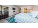 Inviting bedroom features tile floors, balcony access, and a soothing coastal aesthetic at 19531 Gulf Blvd # 604, Indian Shores, FL 33785