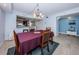 Open-concept dining area with chandelier lighting, next to the kitchen at 19531 Gulf Blvd # 604, Indian Shores, FL 33785