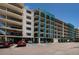 Beautiful exterior view of a condo building featuring balconies, parking, and architectural details at 19531 Gulf Blvd # 604, Indian Shores, FL 33785