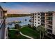 Scenic waterfront view, showing the condos complex, the waterway and boat docks with lush landscaping at 19531 Gulf Blvd # 604, Indian Shores, FL 33785