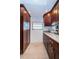 Kitchen area featuring stainless steel appliances, wood cabinets, and granite countertops at 19531 Gulf Blvd # 604, Indian Shores, FL 33785