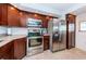 Updated kitchen boasts stainless steel appliances, granite countertops, and beautiful wood cabinetry at 19531 Gulf Blvd # 604, Indian Shores, FL 33785