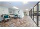 Inviting lobby area with comfortable seating, tiled floors, and views through glass windows at 19531 Gulf Blvd # 604, Indian Shores, FL 33785