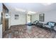 Condo lobby featuring tiled floor, comfortable seating, an elevator, and natural light at 19531 Gulf Blvd # 604, Indian Shores, FL 33785