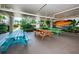 A colorful picnic area offers multiple tables for outdoor dining with tropical landscaping surrounding the space at 19531 Gulf Blvd # 604, Indian Shores, FL 33785
