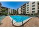Enjoy the community pool surrounded by plenty of lounge chairs and a well-maintained brick deck in this property at 19531 Gulf Blvd # 604, Indian Shores, FL 33785