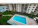 Resort-style pool with lounge chairs, perfect for relaxation and enjoying the sun at 19531 Gulf Blvd # 604, Indian Shores, FL 33785