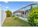 View of the backyard with an enclosed pool and tropical landscaping at 24405 Summer Wind Ct, Lutz, FL 33559