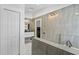 Modern bathroom with stylish tile, bathtub, and double-sink vanity at 24405 Summer Wind Ct, Lutz, FL 33559