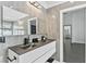 Modern bathroom featuring a double vanity with sleek, contemporary fixtures at 24405 Summer Wind Ct, Lutz, FL 33559