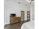 Bedroom with dresser and modern, frosted-window doors at 24405 Summer Wind Ct, Lutz, FL 33559