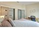 Comfortable bedroom with a closet, ensuite bathroom, and desk area at 24405 Summer Wind Ct, Lutz, FL 33559