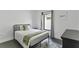 Modern bedroom with stylish decor, a comfortable bed, and lots of natural light at 24405 Summer Wind Ct, Lutz, FL 33559