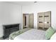 Bright bedroom featuring contemporary closet doors, an ensuite bathroom, and neutral decor at 24405 Summer Wind Ct, Lutz, FL 33559
