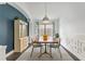 Elegant dining room featuring a wooden table, stylish chairs, modern light fixture, and decorative accents at 24405 Summer Wind Ct, Lutz, FL 33559