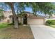 Charming single-story home with a two-car garage and well-maintained landscaping at 24405 Summer Wind Ct, Lutz, FL 33559