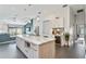 Bright kitchen with large island, modern appliances, and seamless flow to living area at 24405 Summer Wind Ct, Lutz, FL 33559