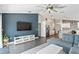 Open-concept living area with stylish furnishings and kitchen view, perfect for entertaining and comfortable living at 24405 Summer Wind Ct, Lutz, FL 33559