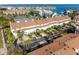 Aerial view of townhouses, community pool, marina, and waterfront views at 269 Madeira Cir, Tierra Verde, FL 33715