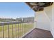 Private balcony showcasing a view of lush green space and surrounding buildings at 269 Madeira Cir, Tierra Verde, FL 33715