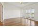 Inviting bedroom with wood floors and shuttered windows, enhancing natural light and style at 269 Madeira Cir, Tierra Verde, FL 33715