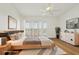 Airy bedroom with light hardwood floors, a ceiling fan, and large windows with shutter coverings at 269 Madeira Cir, Tierra Verde, FL 33715