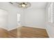 This room has hardwood flooring, fan, closet and is next to a bathroom at 269 Madeira Cir, Tierra Verde, FL 33715