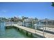 This waterfront property features a private dock and boat lift for easy access to the open water and stunning views at 269 Madeira Cir, Tierra Verde, FL 33715