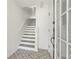 Entryway boasts decorative tiled floors and a staircase leading to upper level at 269 Madeira Cir, Tierra Verde, FL 33715