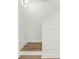 Hallway with wood-look floors and decorative accent wall at 269 Madeira Cir, Tierra Verde, FL 33715