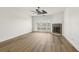 Bright living room with a stone fireplace, wood flooring, and natural light from the sliding glass doors at 269 Madeira Cir, Tierra Verde, FL 33715