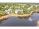 Aerial view featuring the lake with fountain, surrounded by condos and beautifully kept landscaping at 3261 Haviland Ct # 303, Palm Harbor, FL 34684