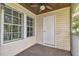 Inviting screened-in balcony featuring a stylish ceiling fan and natural light, ideal for relaxation at 3261 Haviland Ct # 303, Palm Harbor, FL 34684