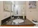 Bathroom featuring modern sink, dark countertop, and modern faucet at 3261 Haviland Ct # 303, Palm Harbor, FL 34684